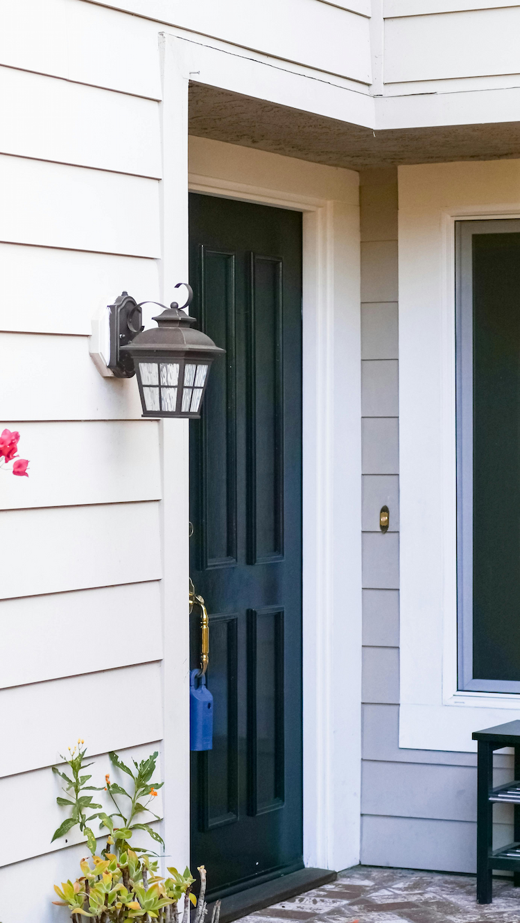 Front door with Real Estate Lockbox on it.